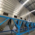Multi-compartment stainless steel storage silo for diverse plastic material management.